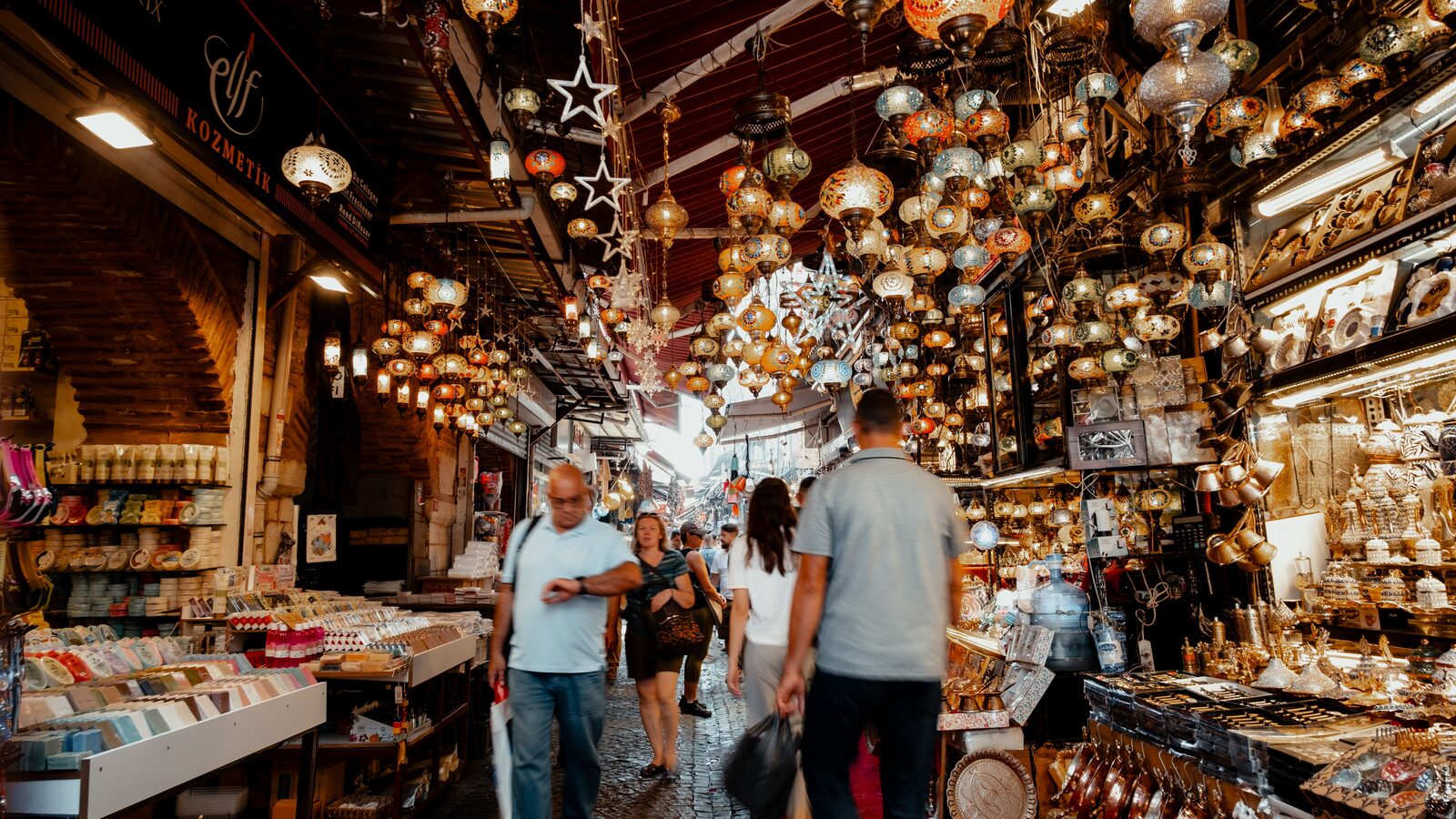 Colourful Turkish lamps and handicrafts glowing inside Istanbul’s Grand Bazaar